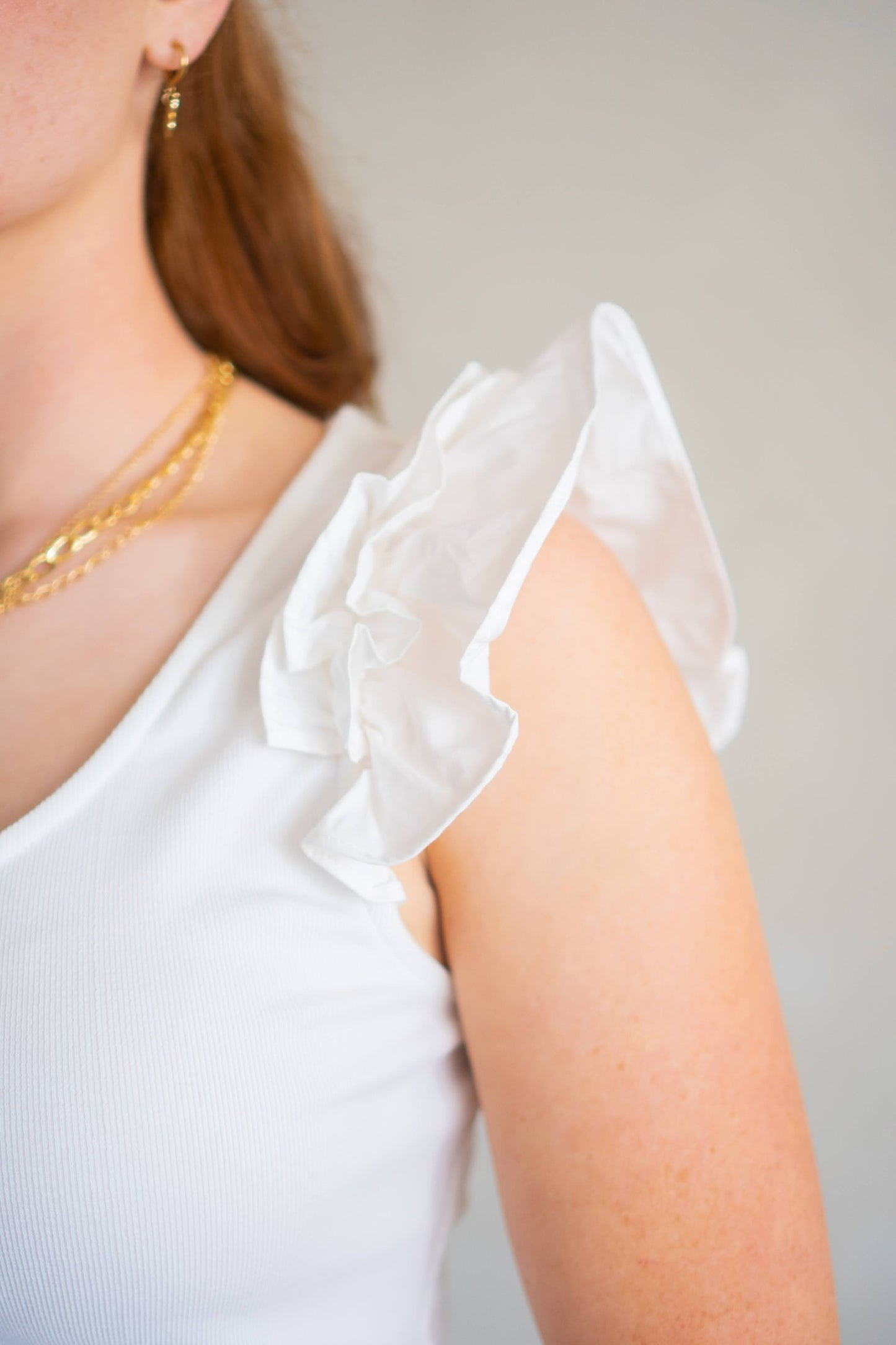 Cotton detail of dainty, puff/flutter sleeve top.