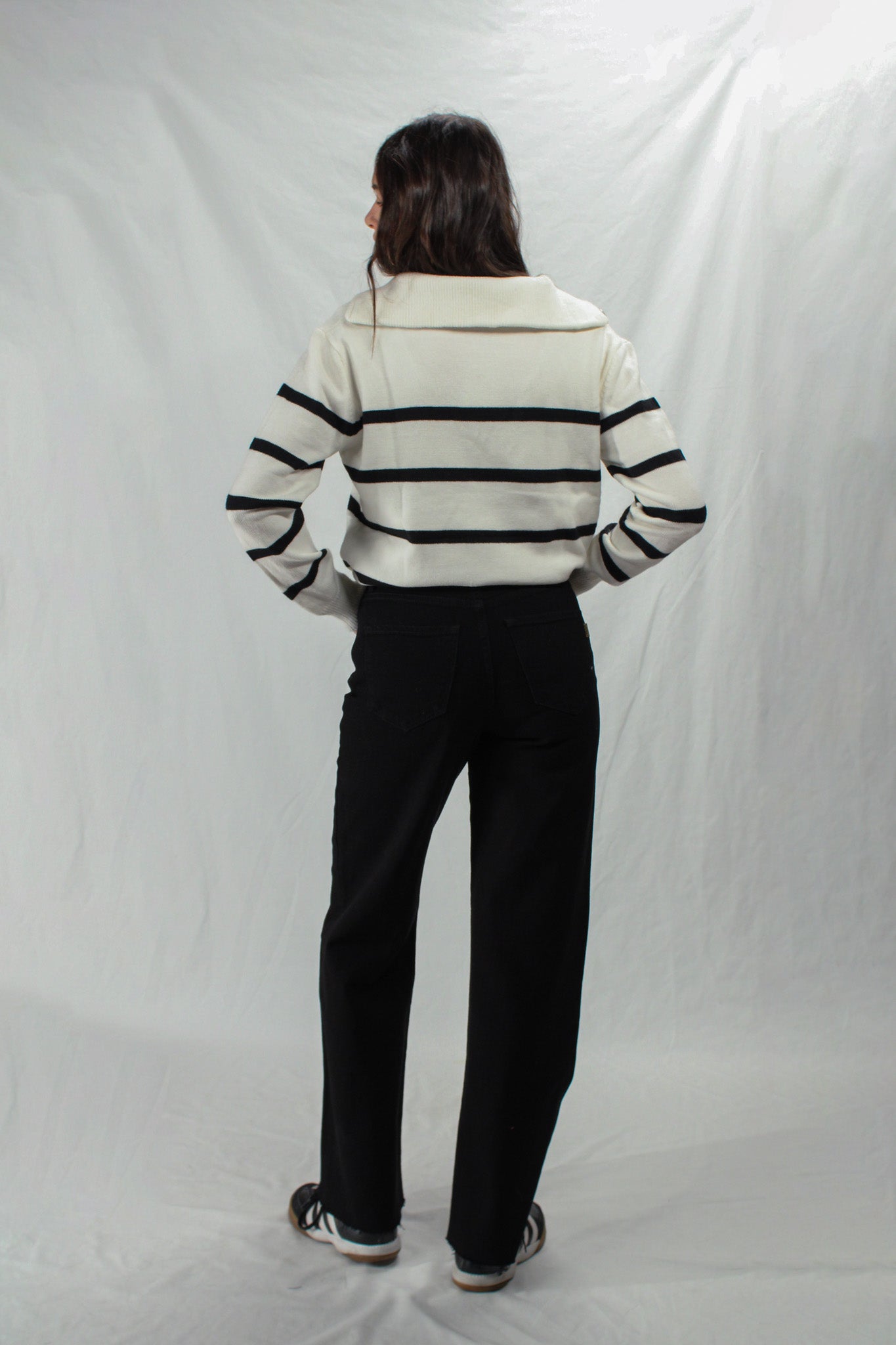 Back of wide leg black crossover jeans