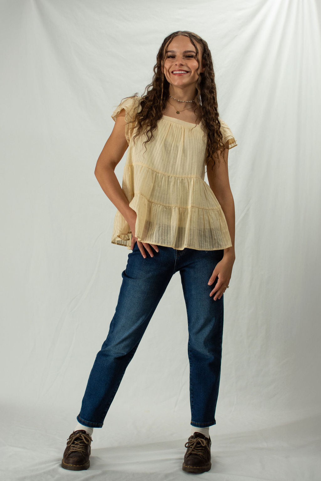 Woman wearing dark blue straight leg mom jeans
