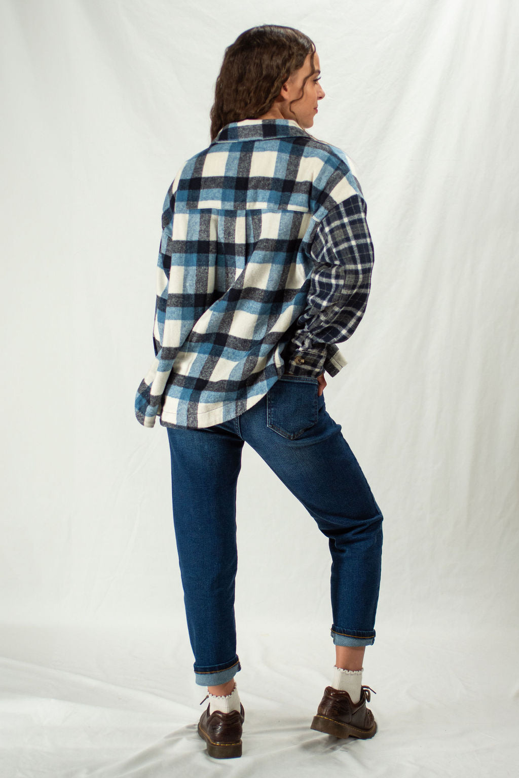 Woman wearing straight leg mom jeans in slim fit and dark wash