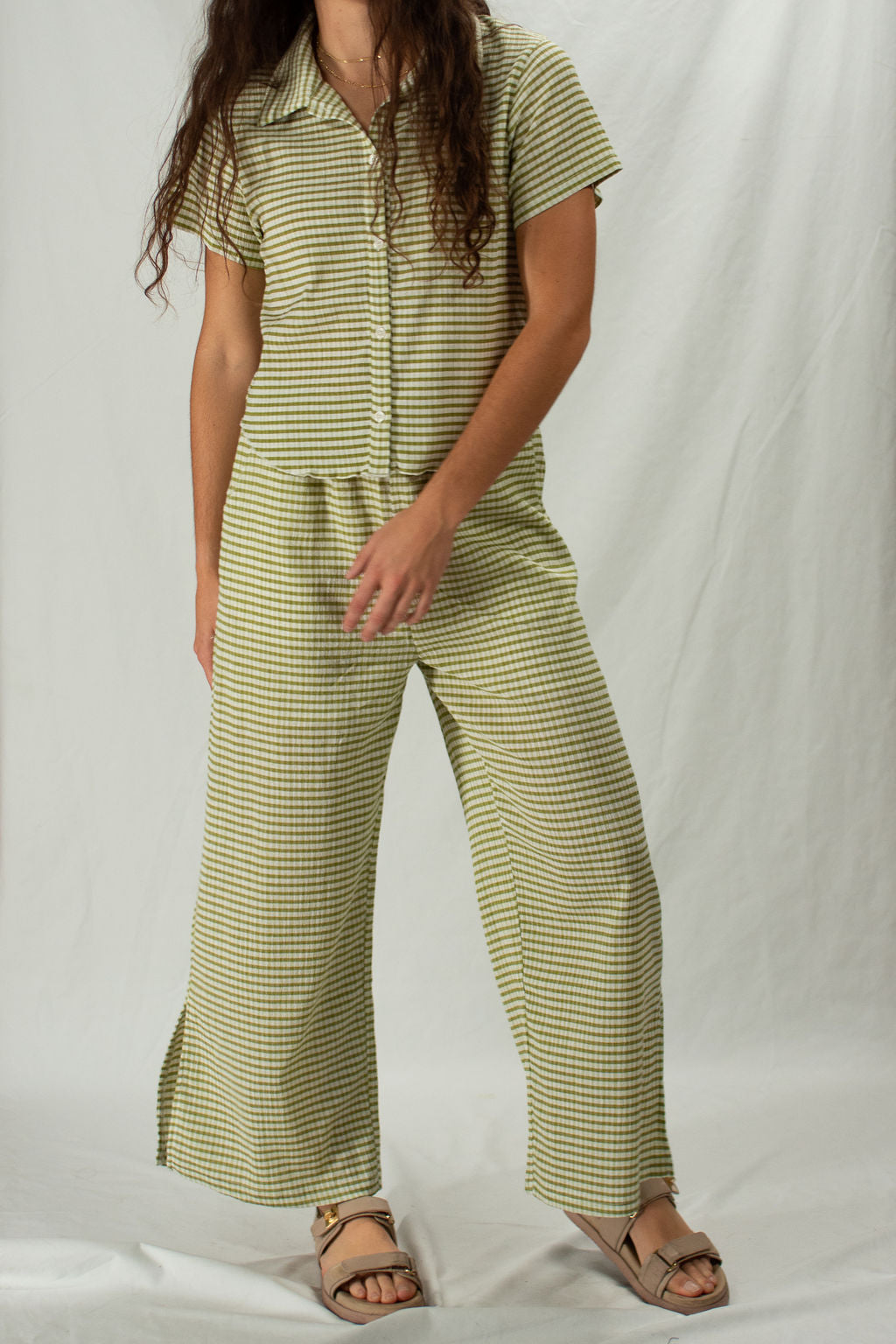 Striped green matching two piece set with button up short sleeve top and wide leg bottoms