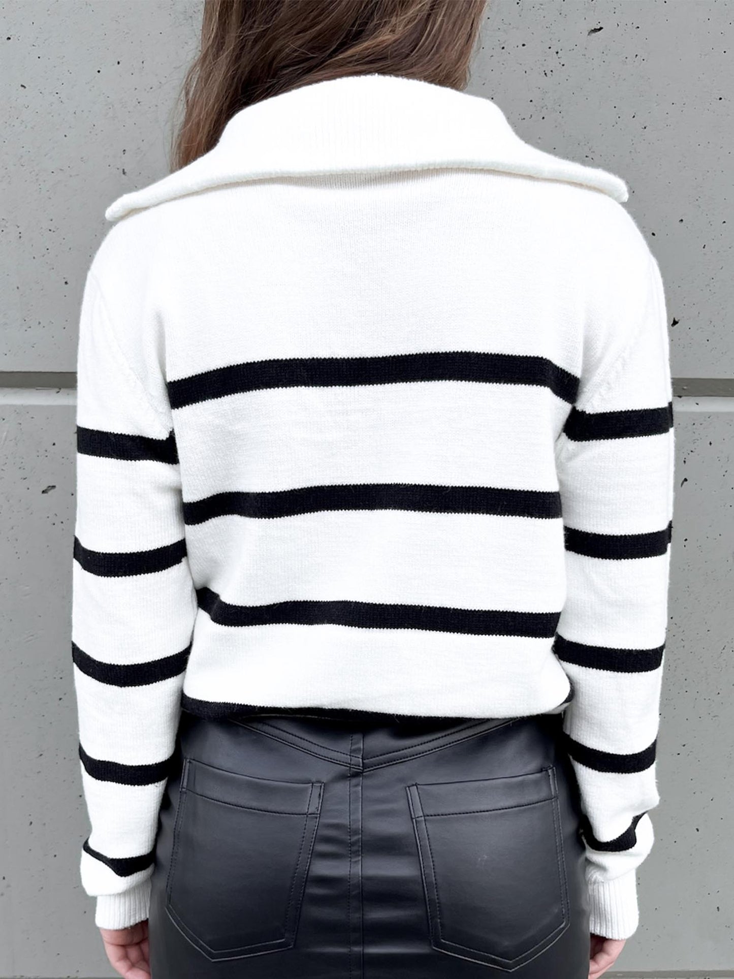 Three quarter zip white sweater with black stripes back