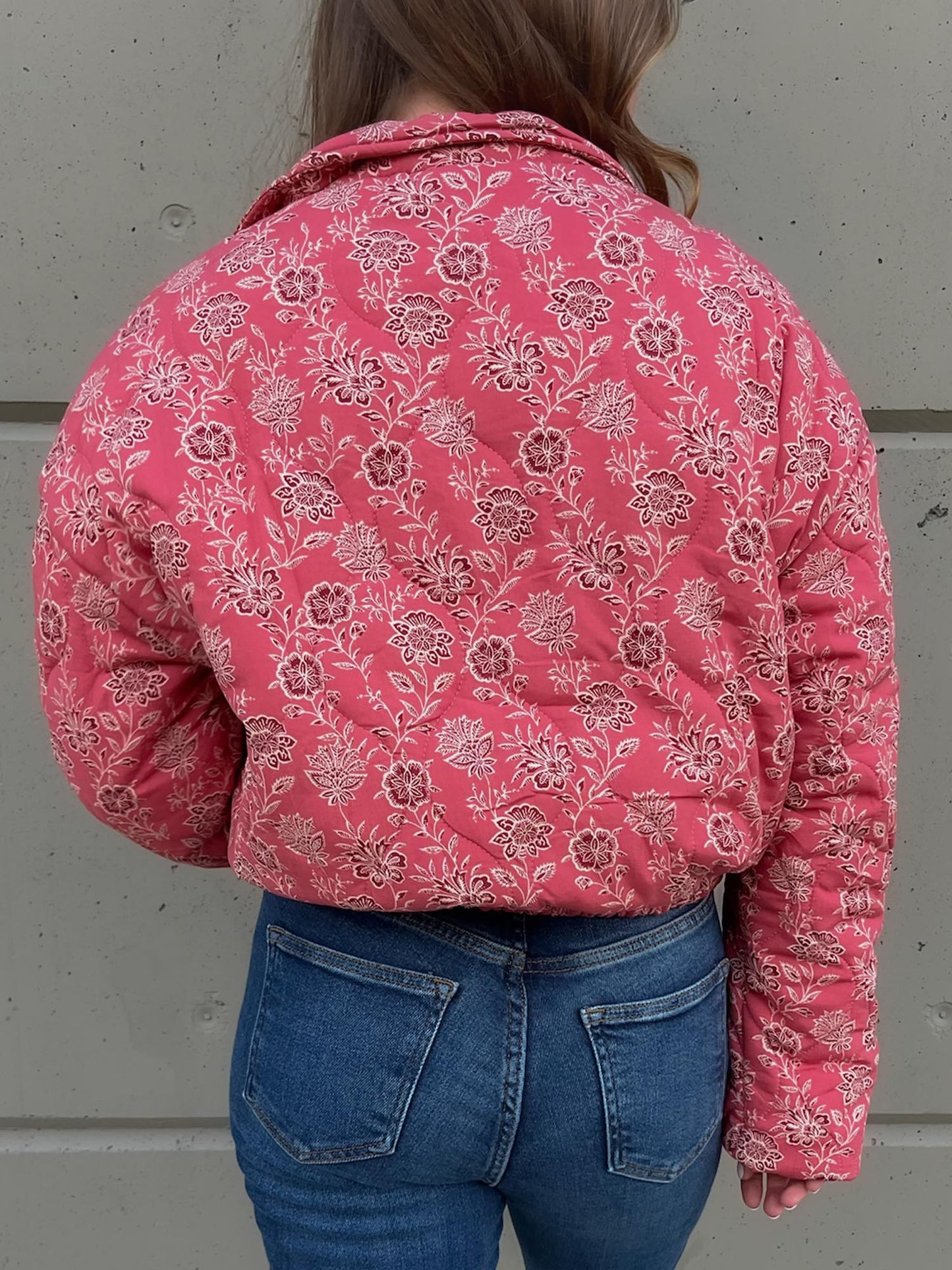 Back of rose floral button up quilted jacket in pink
