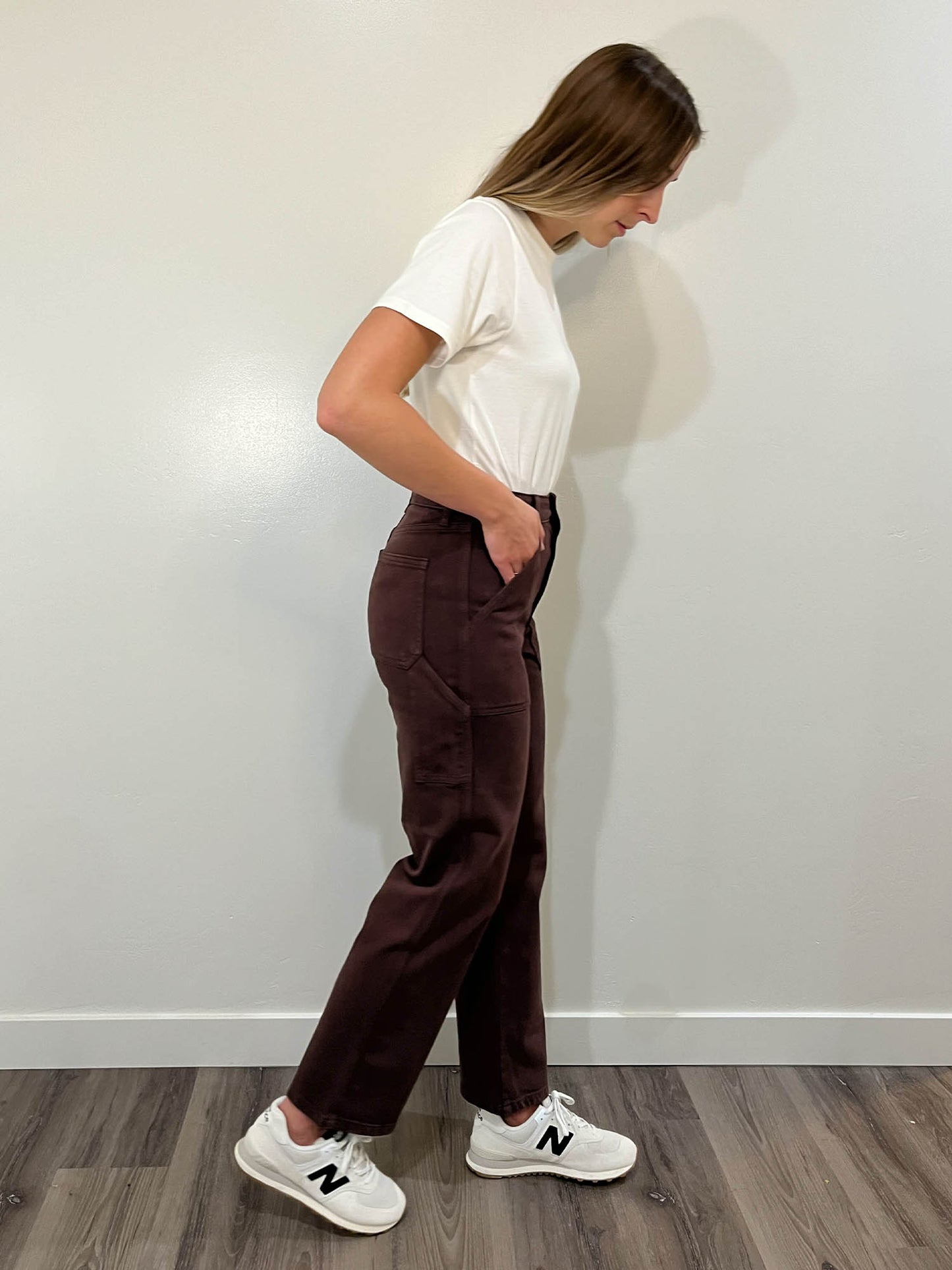 Right side view of brown denim carpenter pants