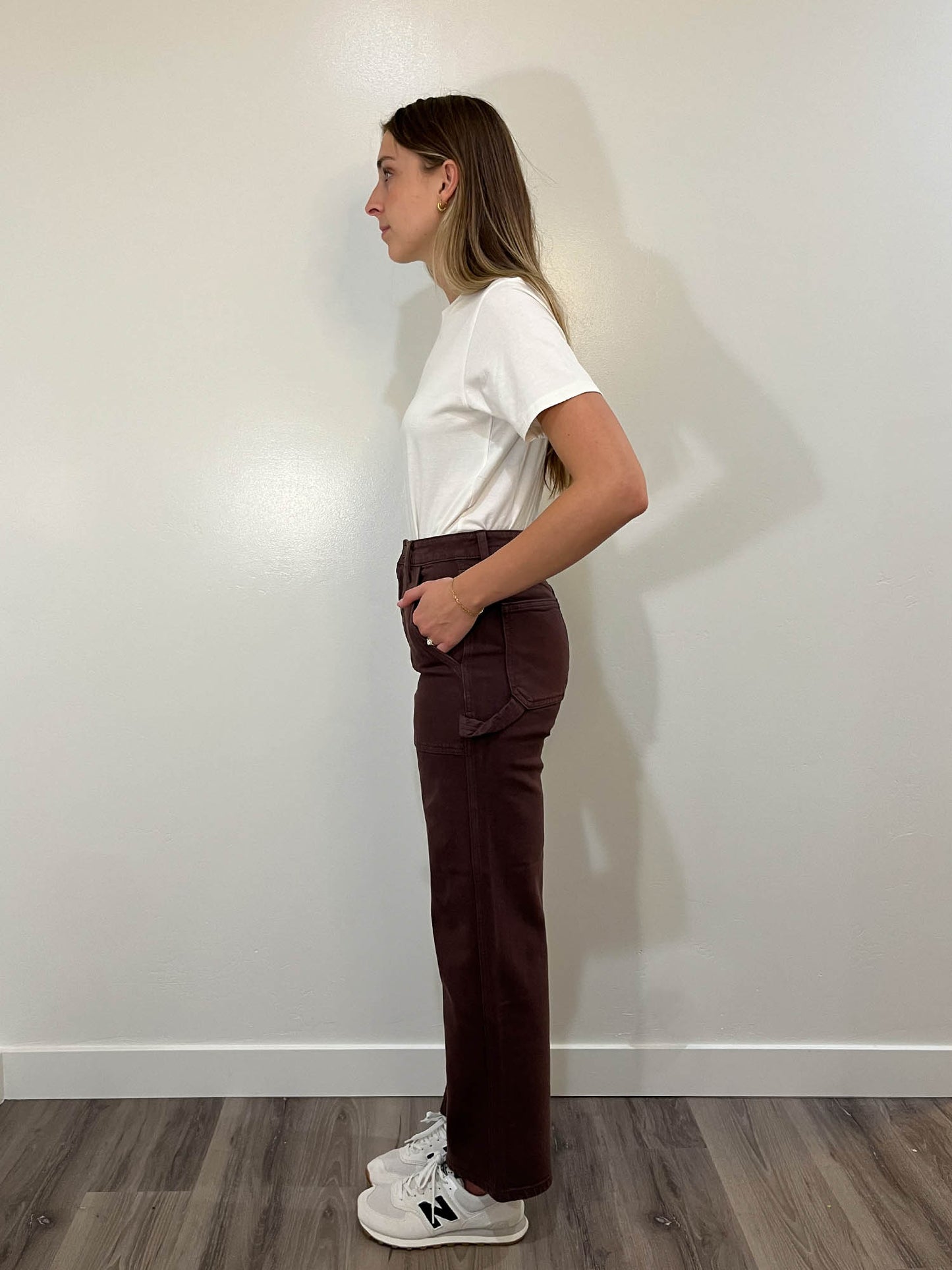 Left side view of brown denim carpenter pants