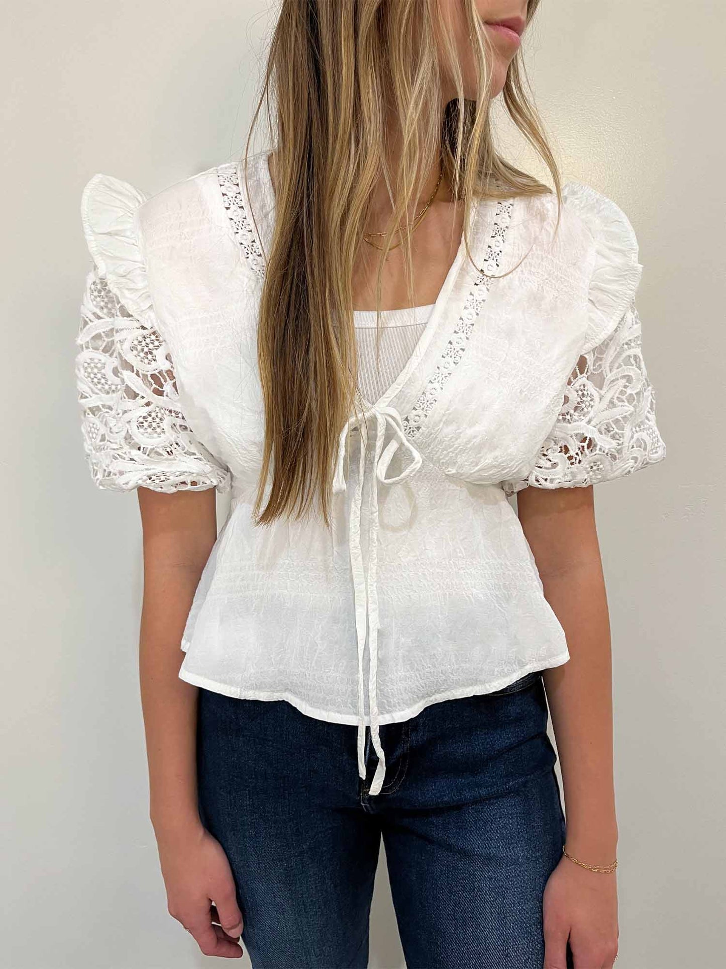 White lace, puff-sleeve peplum blouse with front tie