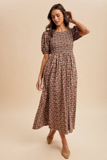 Woman wearing a floral dress against a beige background