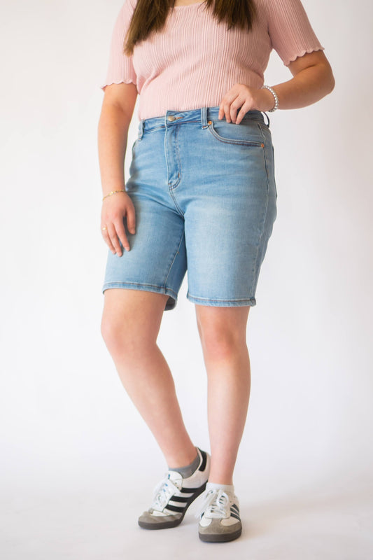 Knee length stretch denim Bermuda shorts.