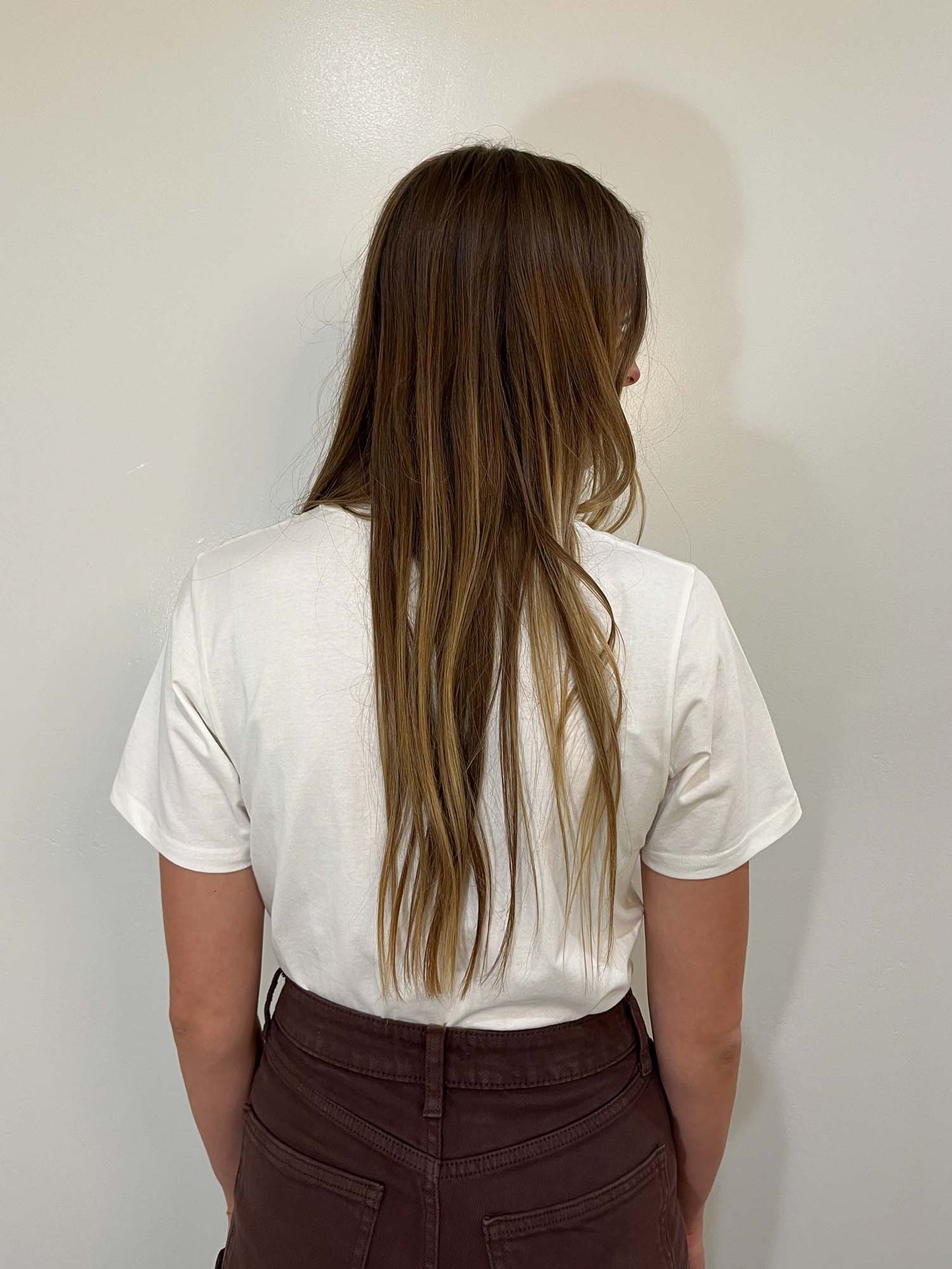 Non-see through, loose fit white tee, back view